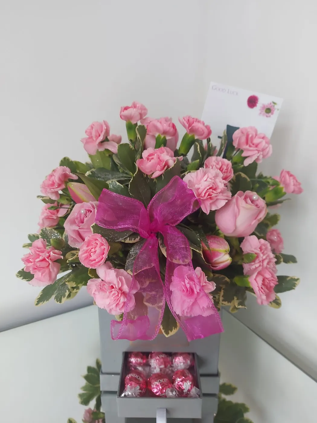 Large pink hand-tied bouquet with bow by Polly's Flowers, Tipton