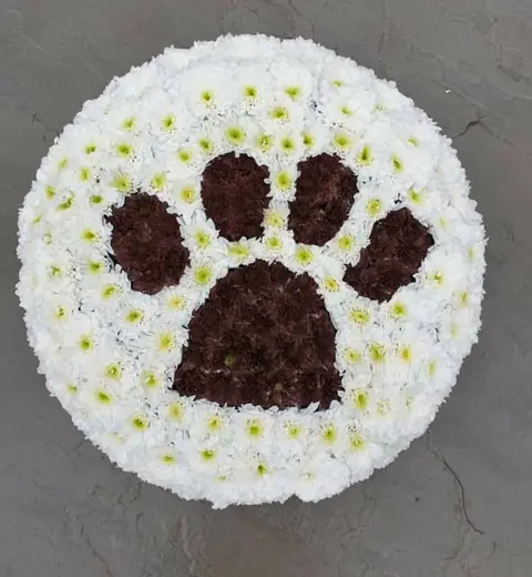 Bespoke paw print floral tribute by Polly's Flowers