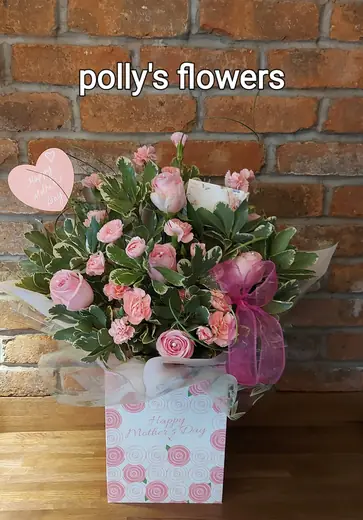 Pink gift-box flower arrangement by Polly's Flowers